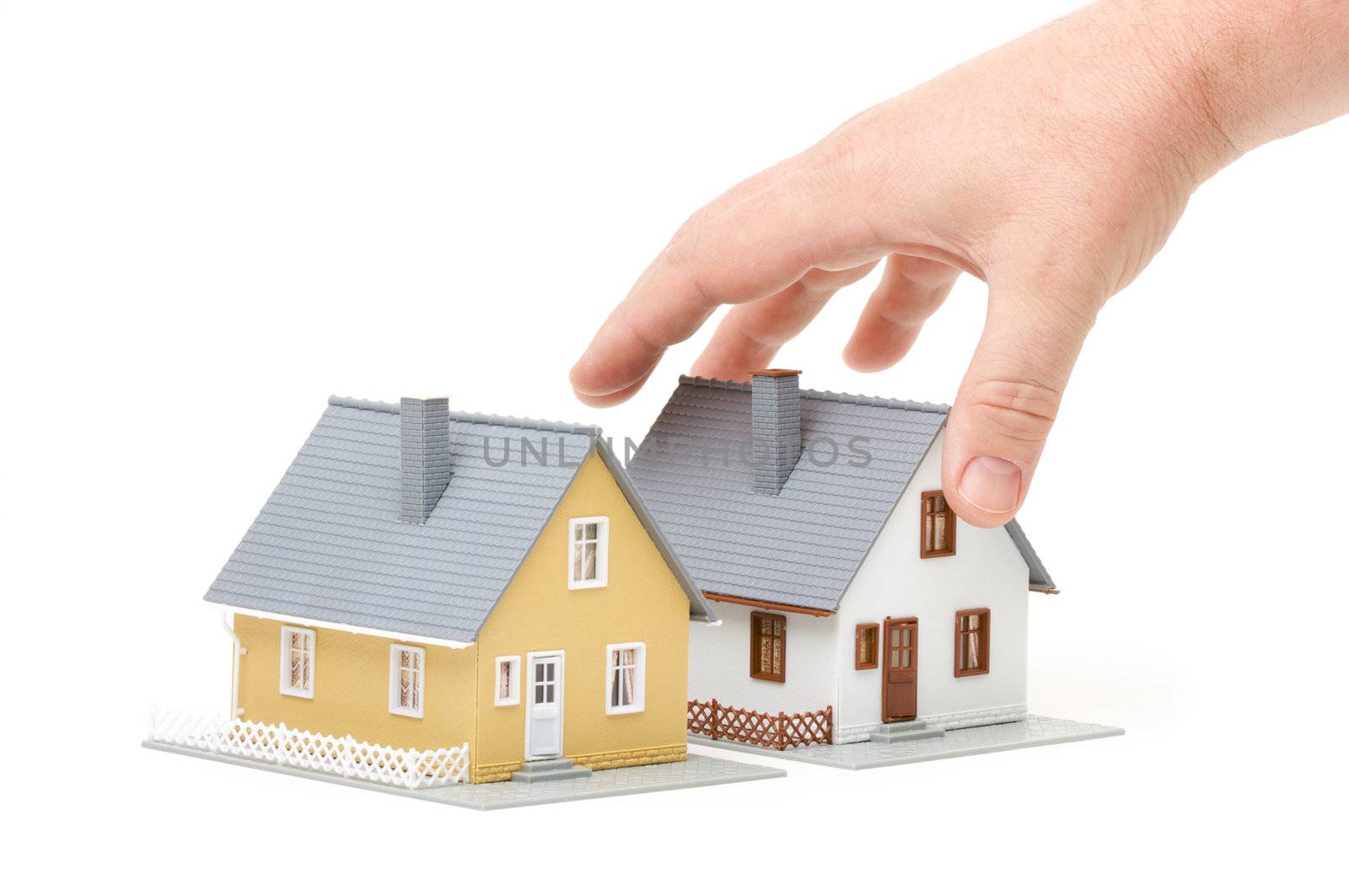 Male hand reaching for house isolated on a white background.