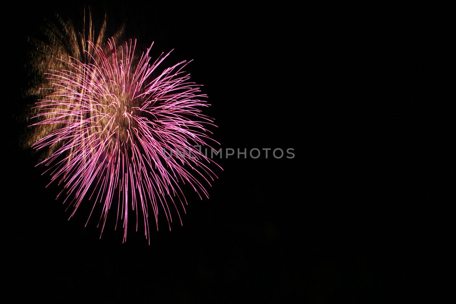 colorful fireworks with some copy space to the right