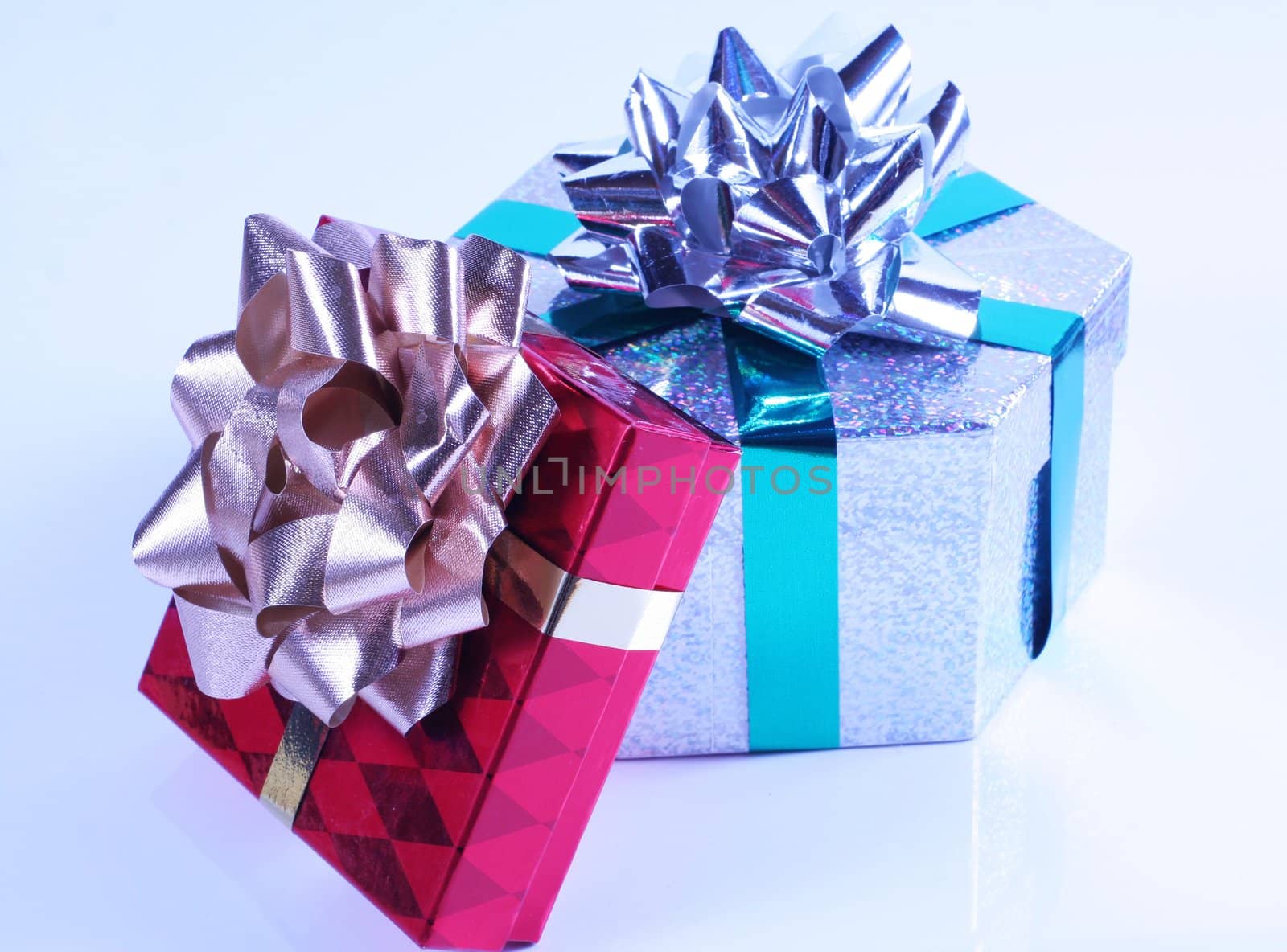 Shiny presents with ribbons and bows on white background.