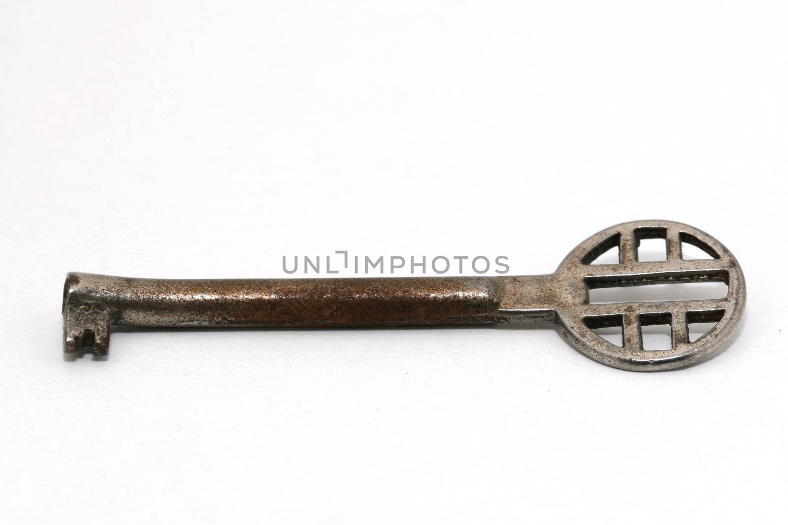 An old vintage key on white background