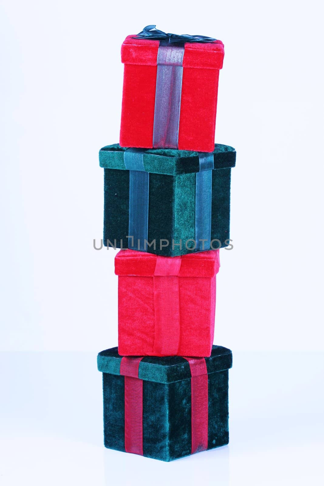 Red and green presents stacked by jarenwicklund