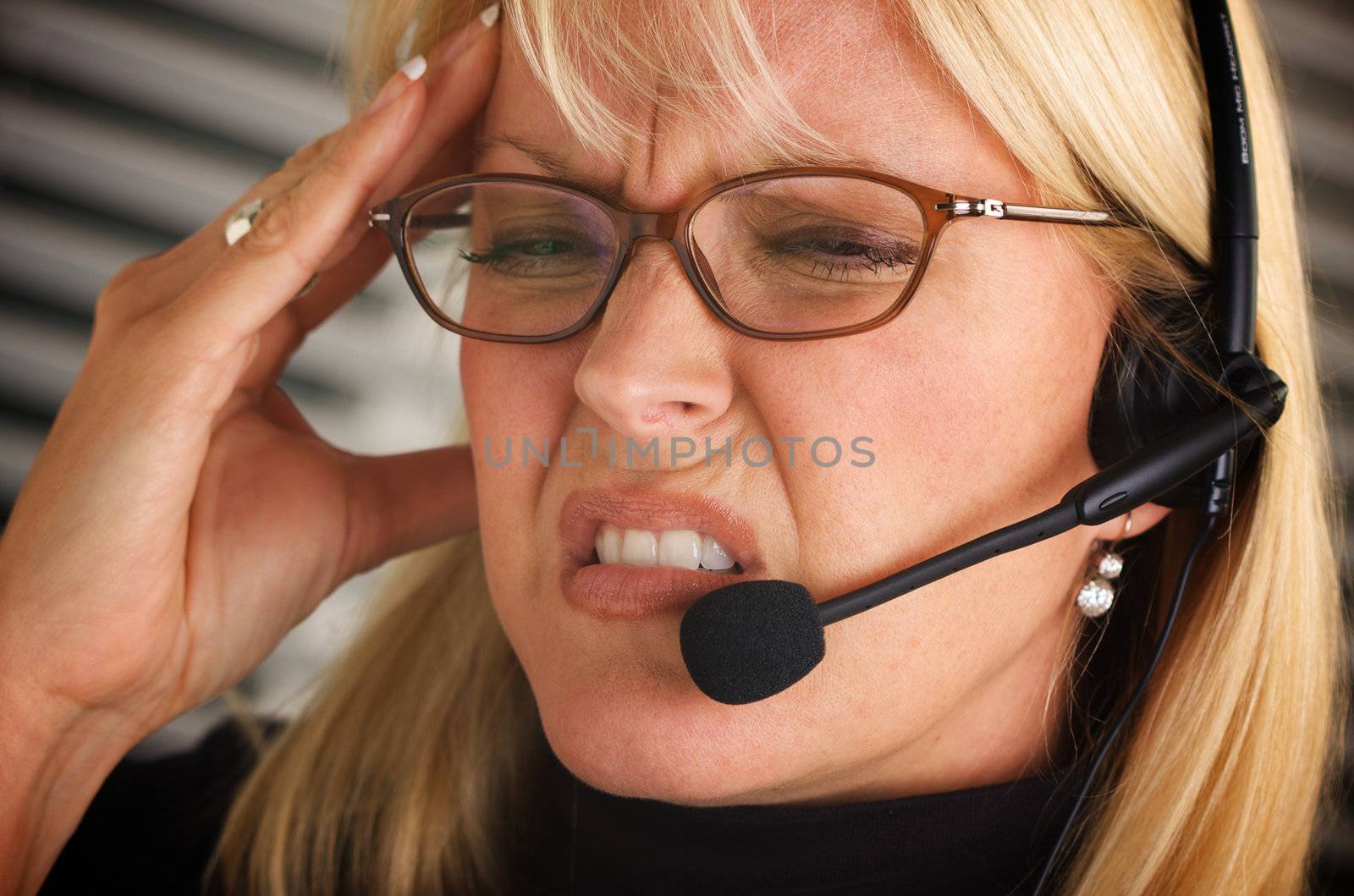 Businesswoman with Phone Headset and Headache by Feverpitched