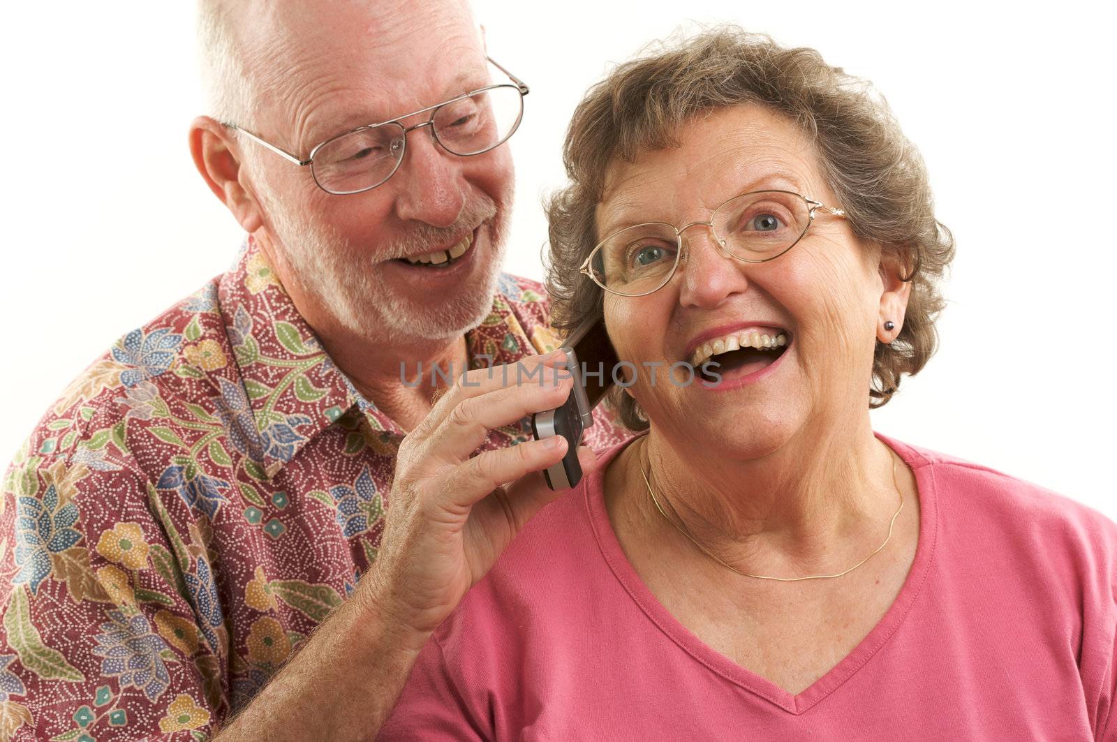 Senior Couple using a cell phone.