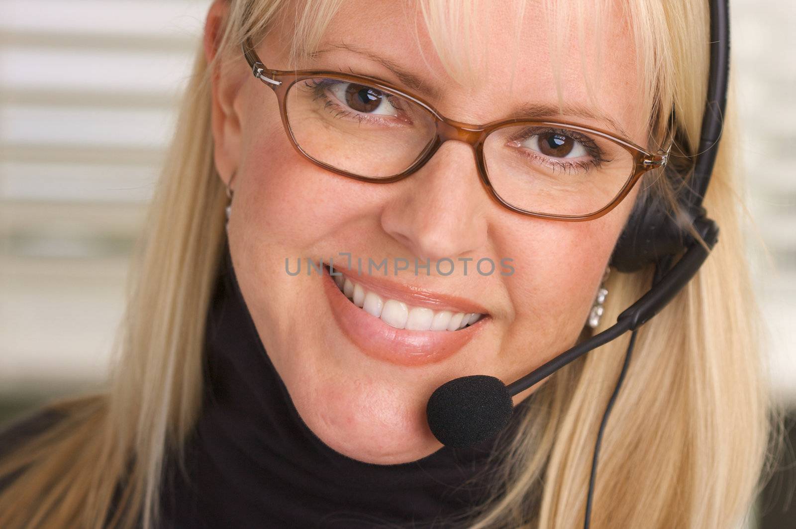Attractive Businesswoman with Phone Headset by Feverpitched