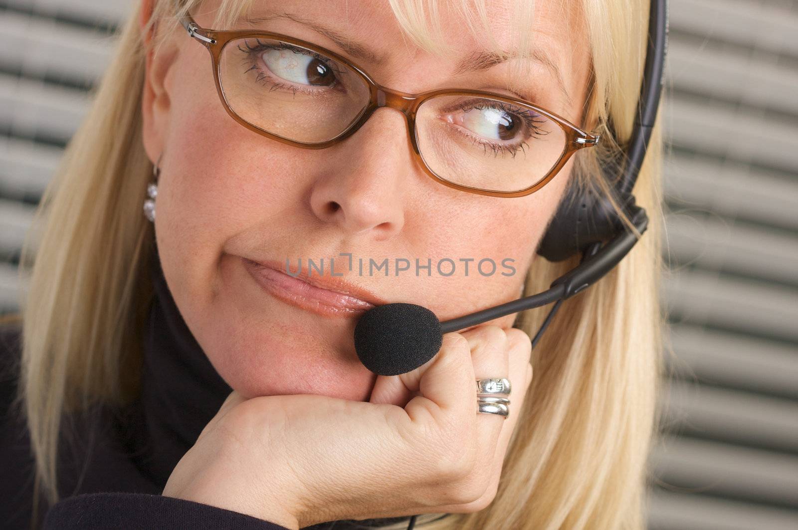 Attractive Businesswoman with Phone Headset by Feverpitched