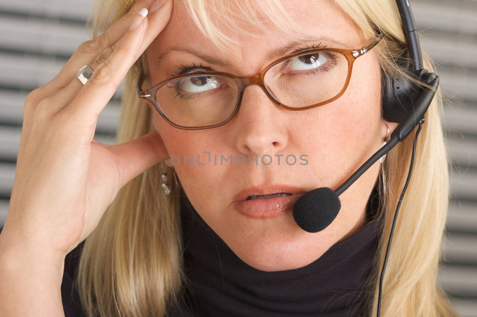 Businesswoman with Phone Headset and Headache by Feverpitched
