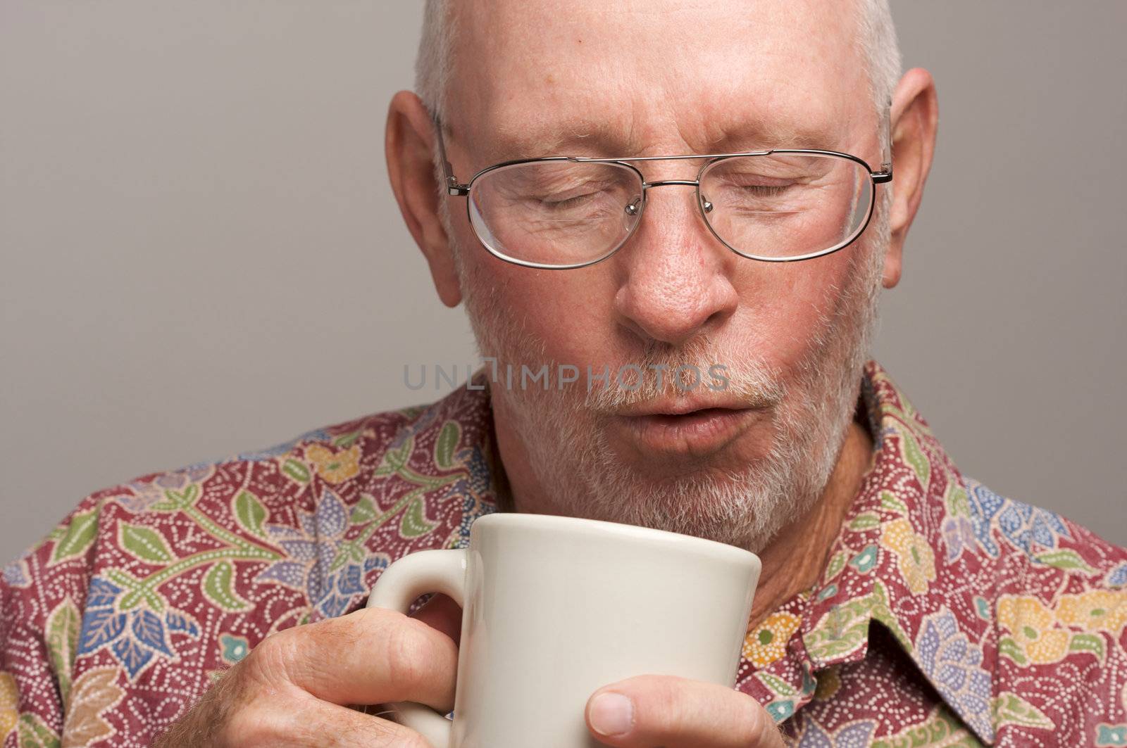 Senior Man Enjoys His Coffee by Feverpitched