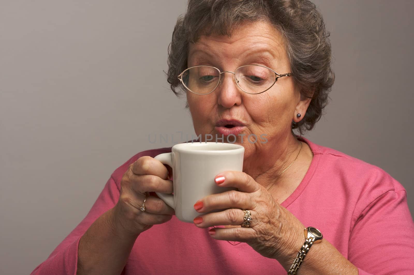 Senior Woman Enjoys Her Coffee by Feverpitched