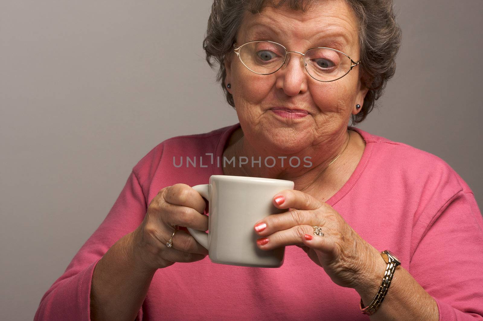 Senior Woman Enjoys a Cup of Coffee