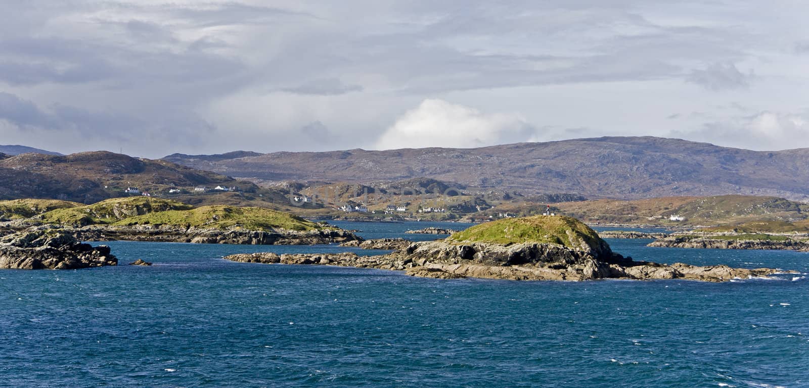 coastal landscape on scottish isle with wetland and hills