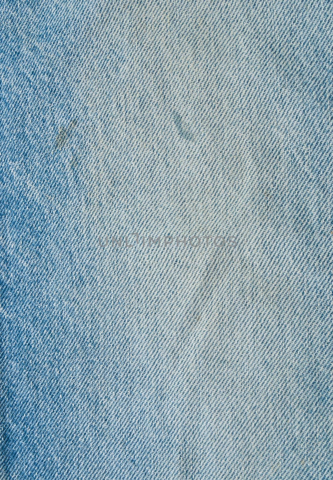 Striped textured used blue jeans denim fabric grunge background