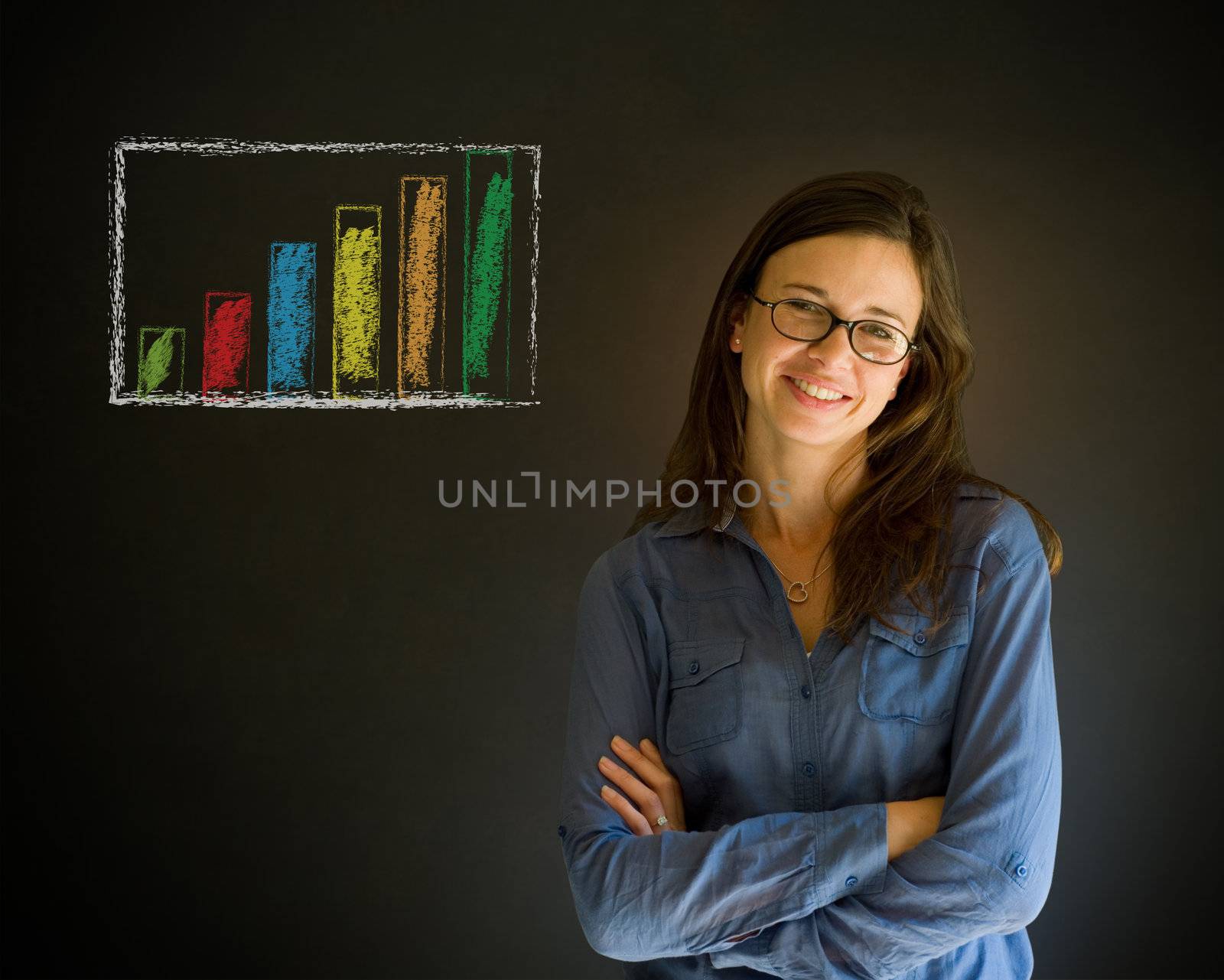 Confident business woman or teacher with arms crossed against a blackboard background