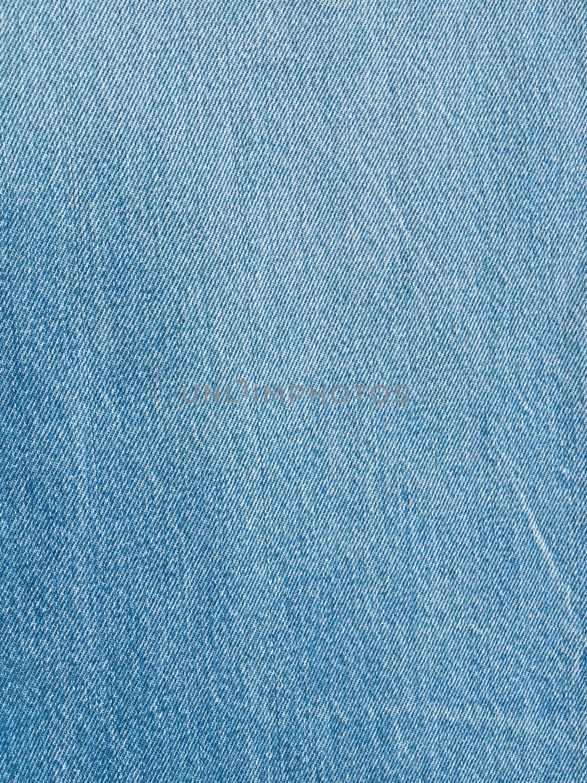 Striped textured used blue jeans denim fabric grunge background