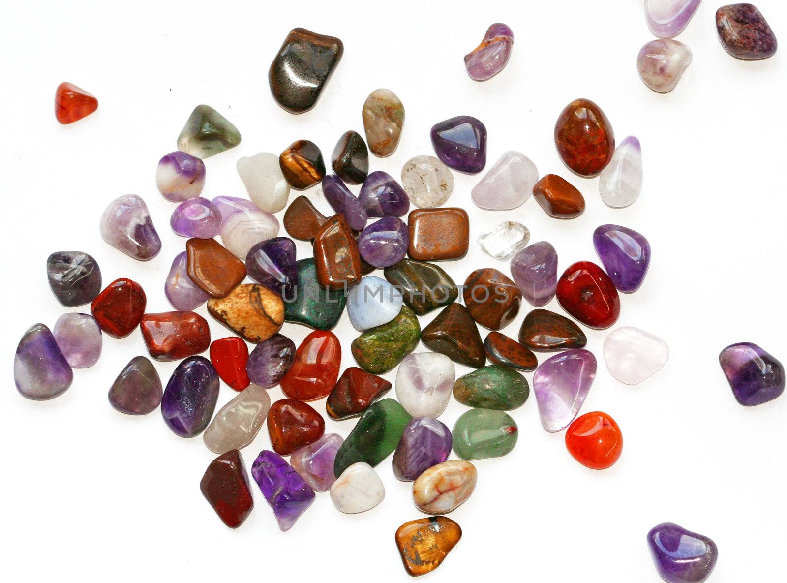 Colorful semiprecious stones on white background