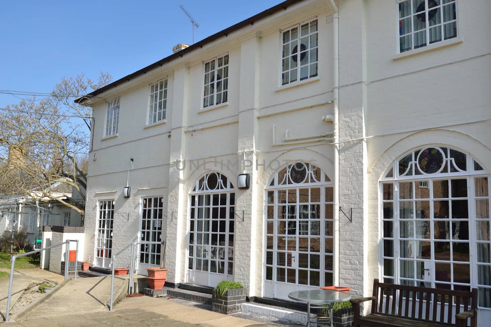 Row of cast iron windows on back of house