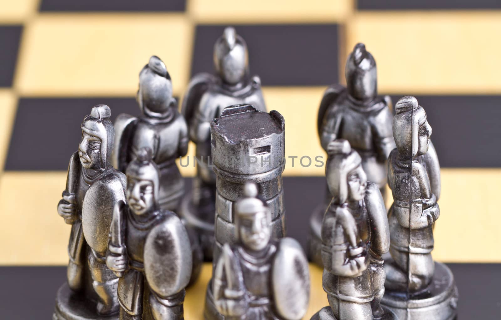 pawn pieces surrounding the rook piece