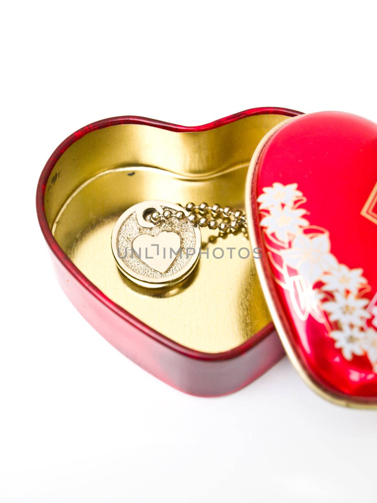 A golden stainless stell heart with a miniature heart keychain i by gururugu