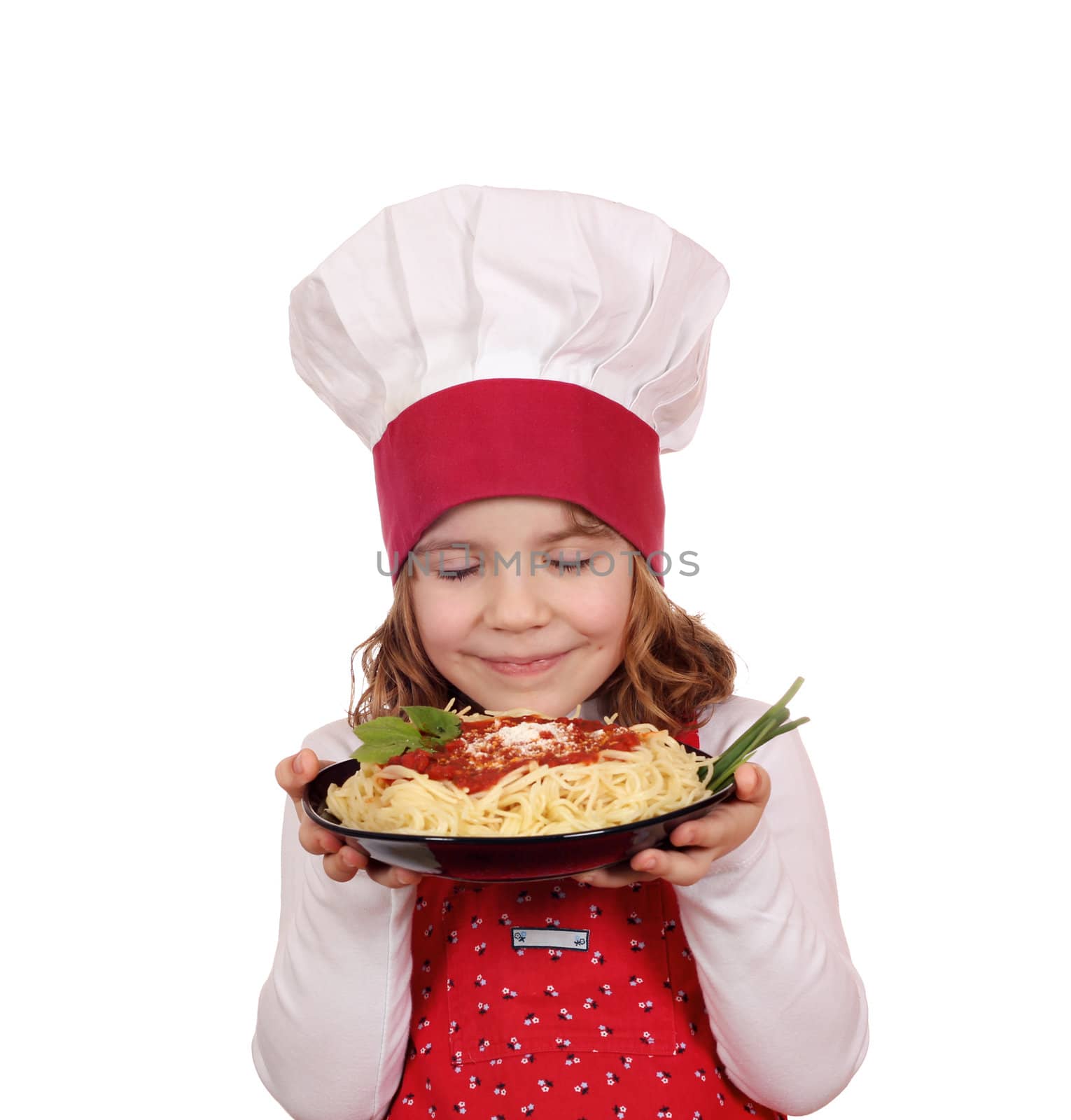 little girl cook enjoys spaghetti