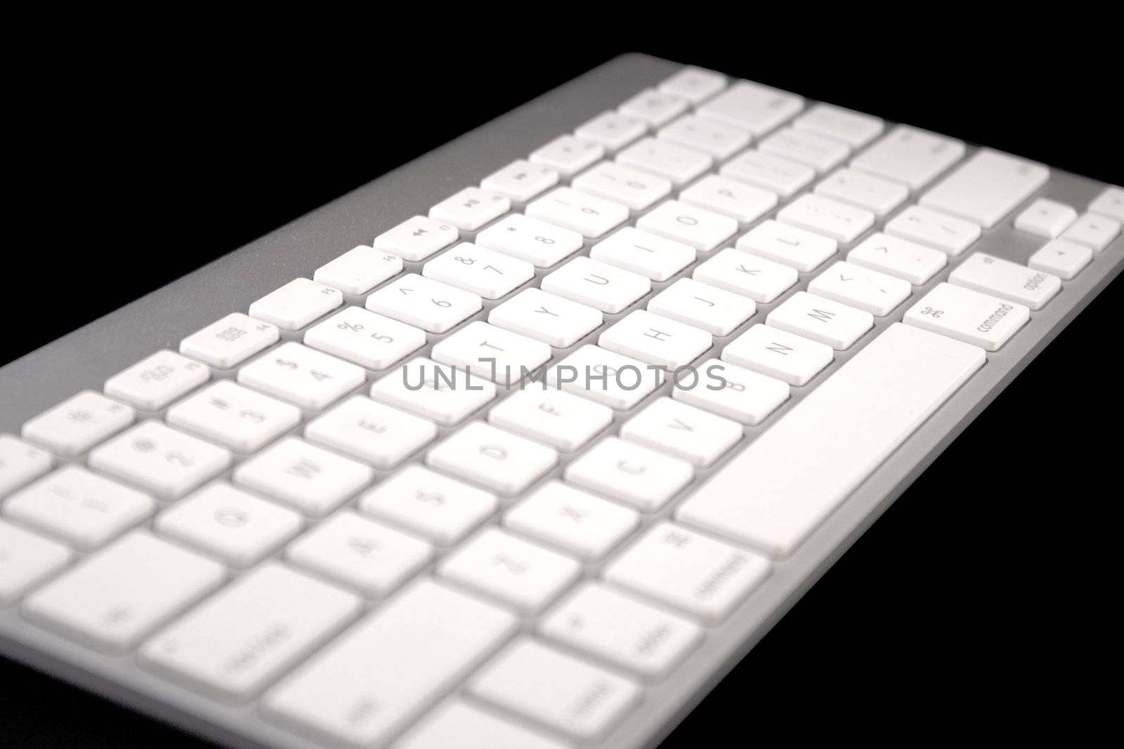 silver Keyboard of a notebook computer. White and black. isolated on black