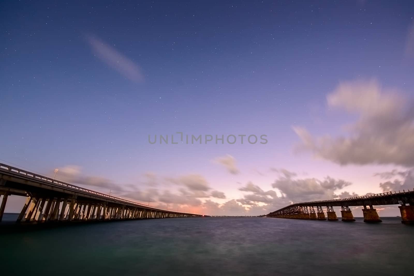 Bridges of Florida Keys under night sky by liseykina