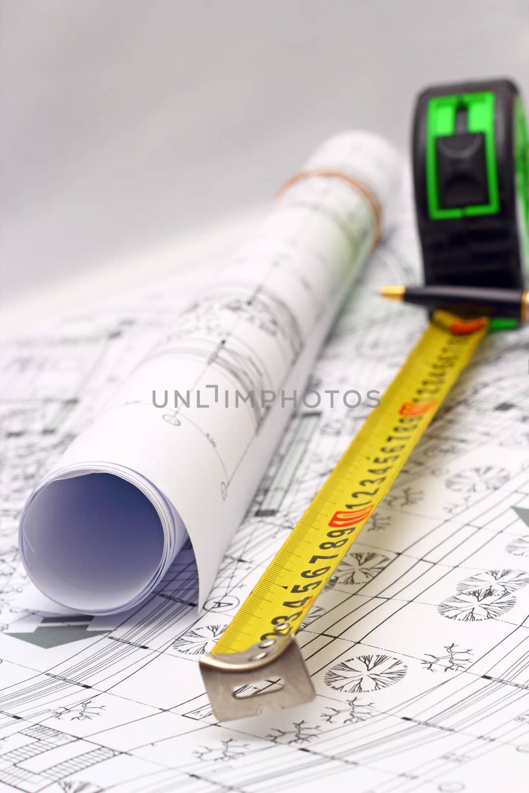 architectural plans and measurement instruments over the office table