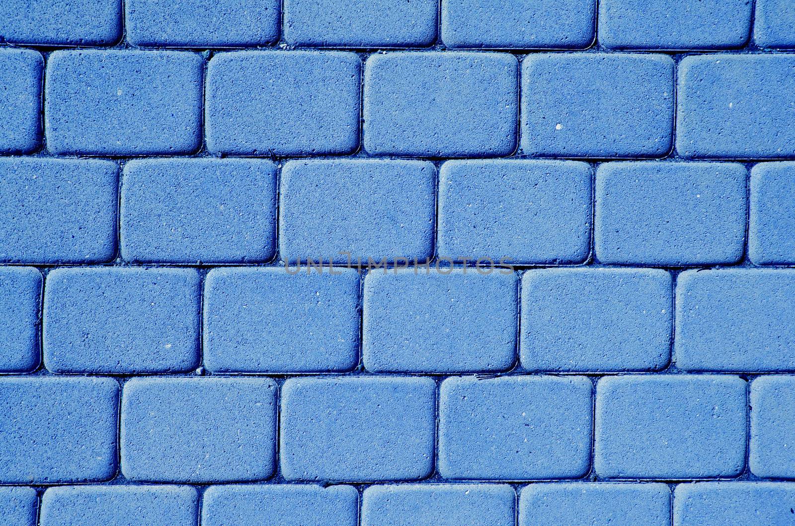 Background of path paved with rectangular, rounded coners tiles.