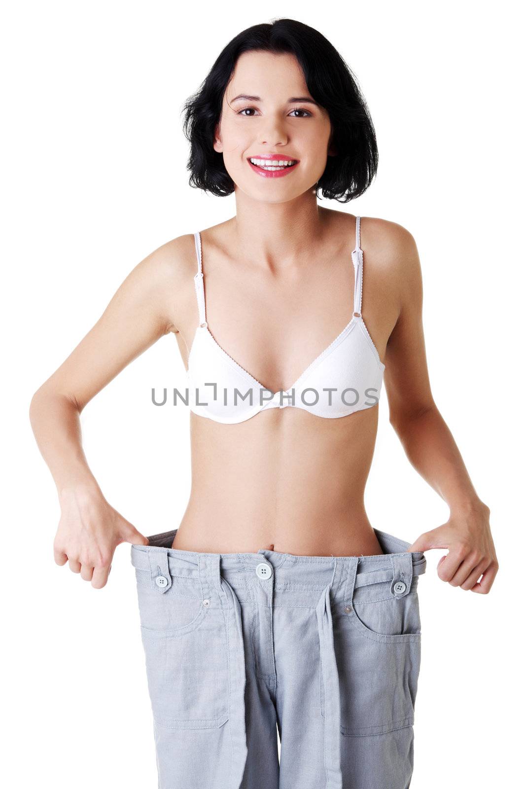 Young woman showing how much weight did she lost. by BDS