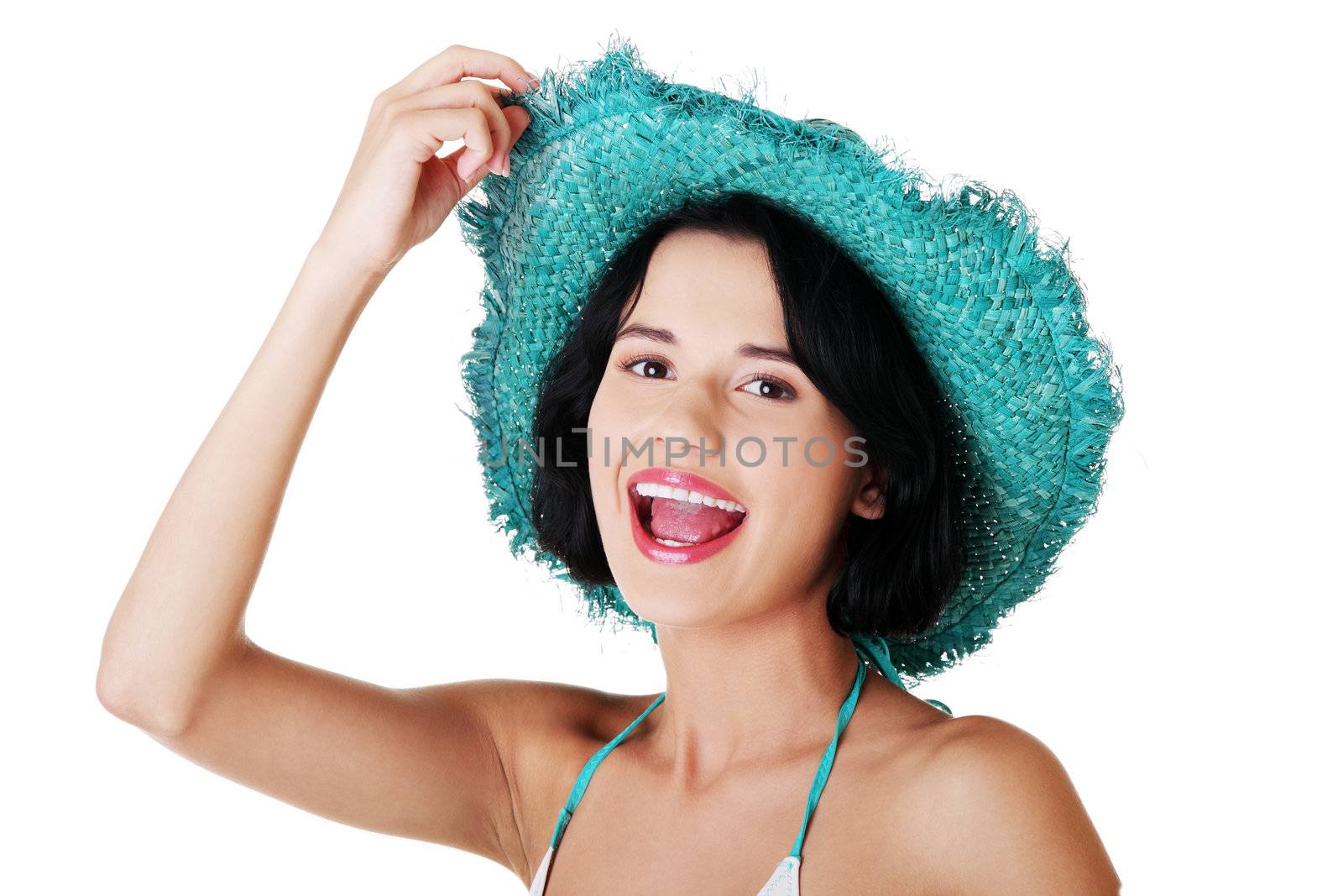 Sexy summer brunette woman posing in hat, over white background