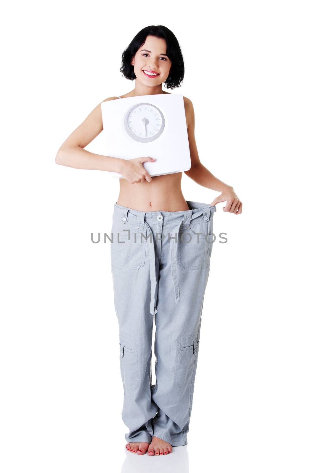 Succesful diet concept - woman with scale.