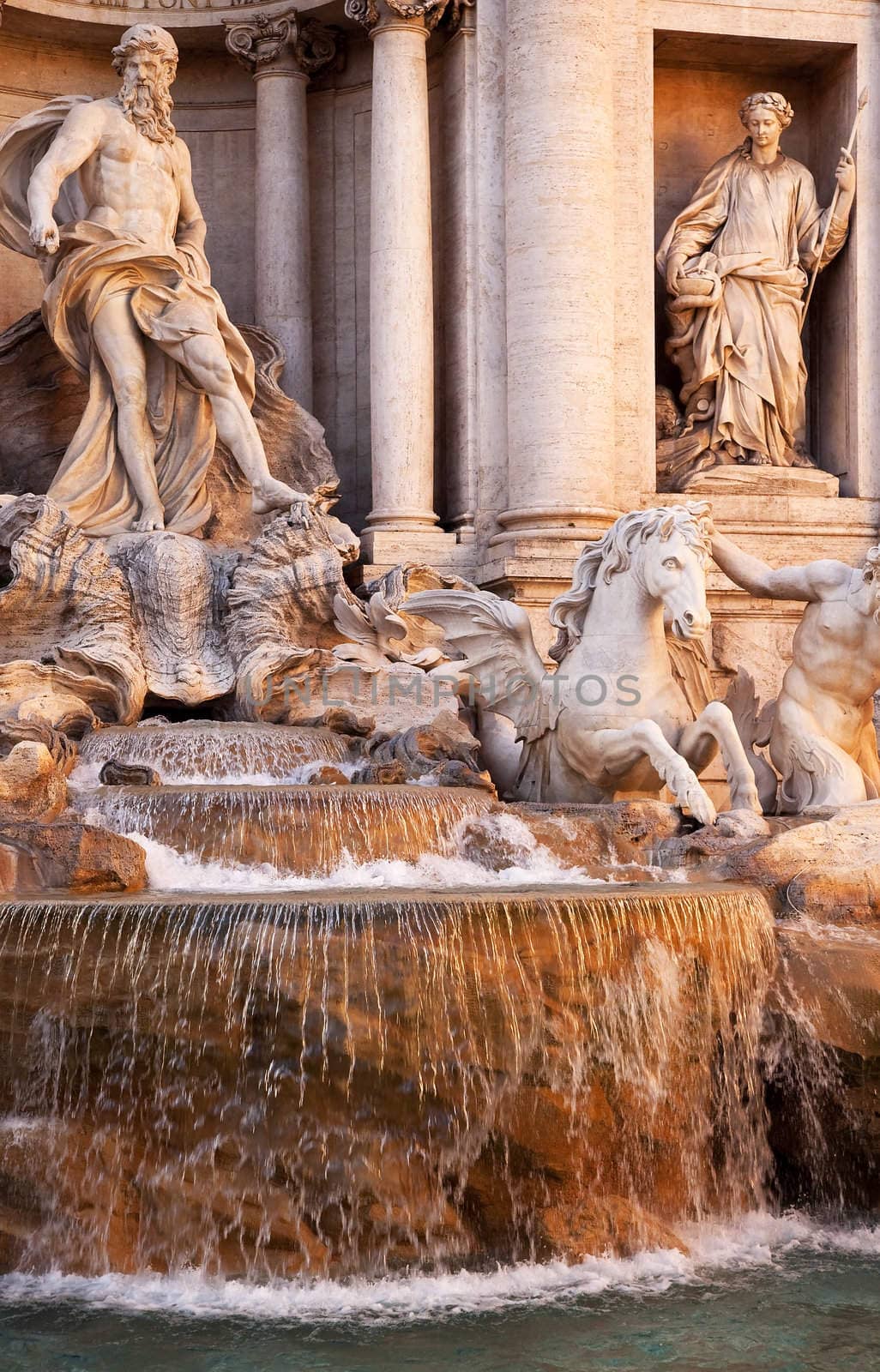 Trevi Fountain , Fontana de Trevi, Close Up, Neptune Statues, Rome Italy Finished by architect Salvi in 1735 who continued work by Bernini.  Legend has it that whoever throws money into the fountain will return to Rome