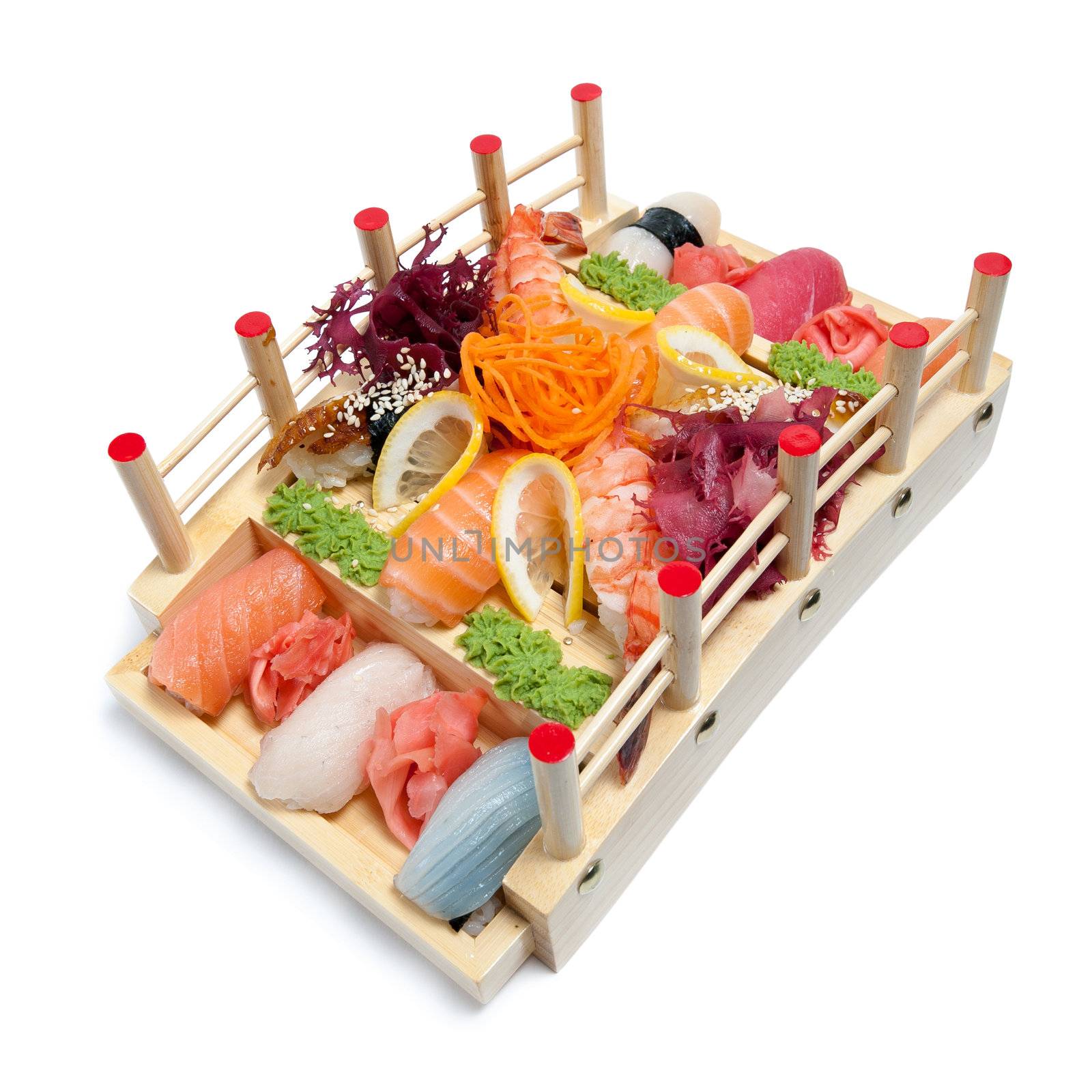 Set of sushi on wooden stand in the form of the bridge isolated on white