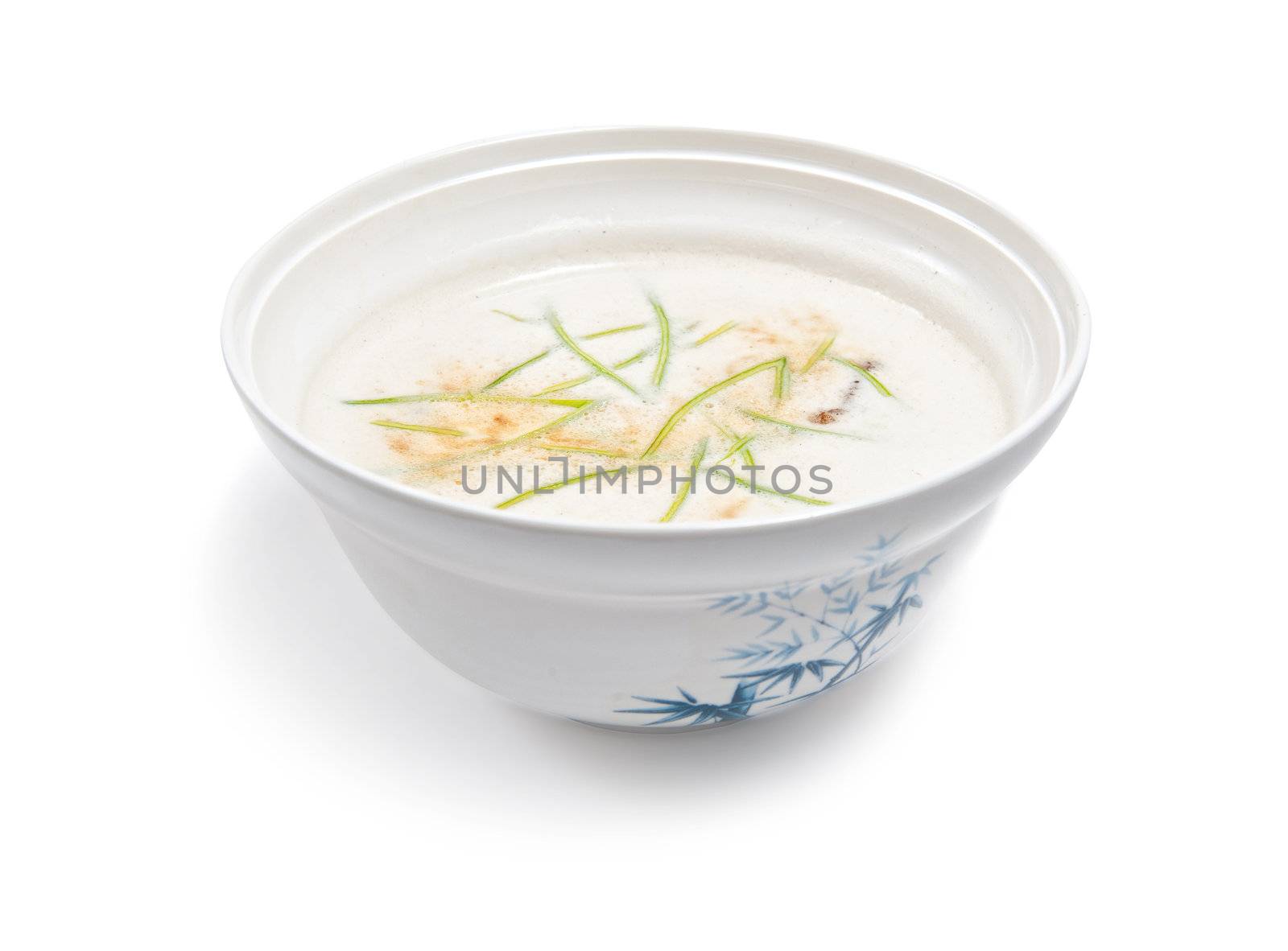 Soup with milk isolated on white