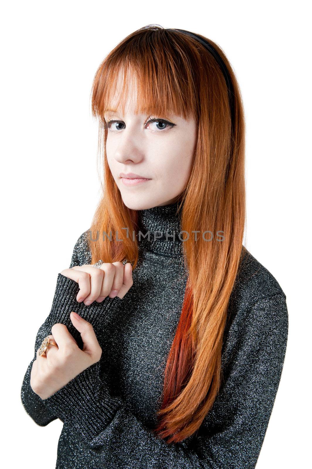 The beautiful girl with red long hair in a sweater isolated on white
