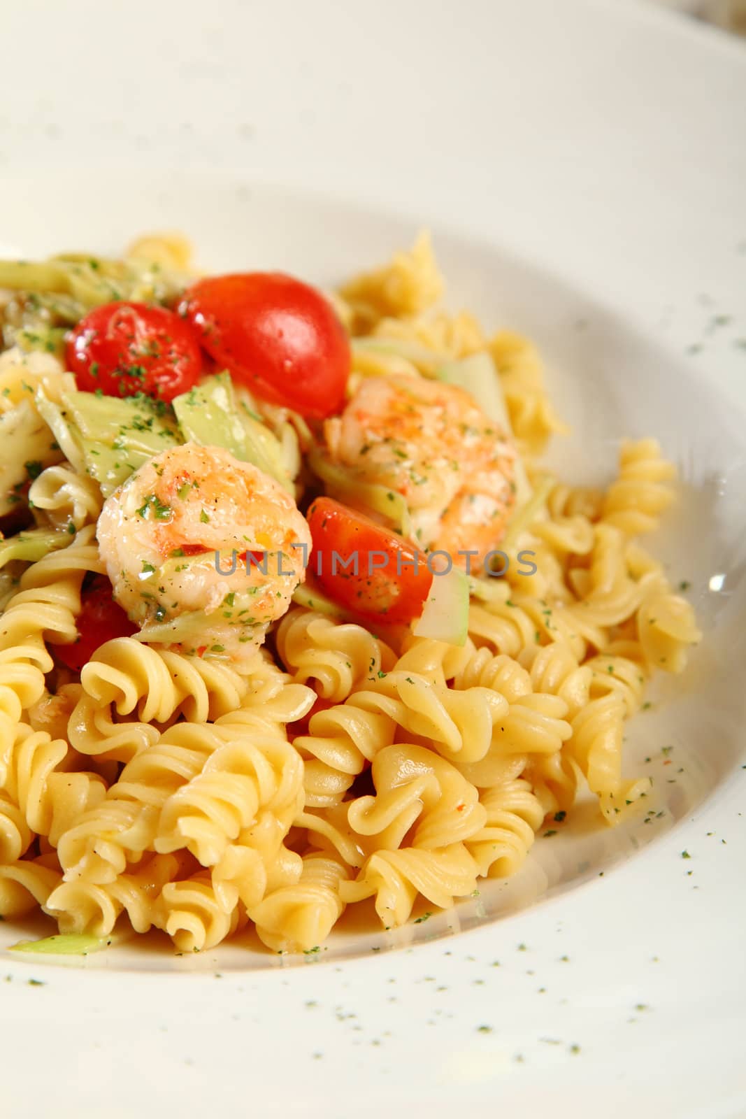 fresh pasta fusilli with shrimps and tomatoes