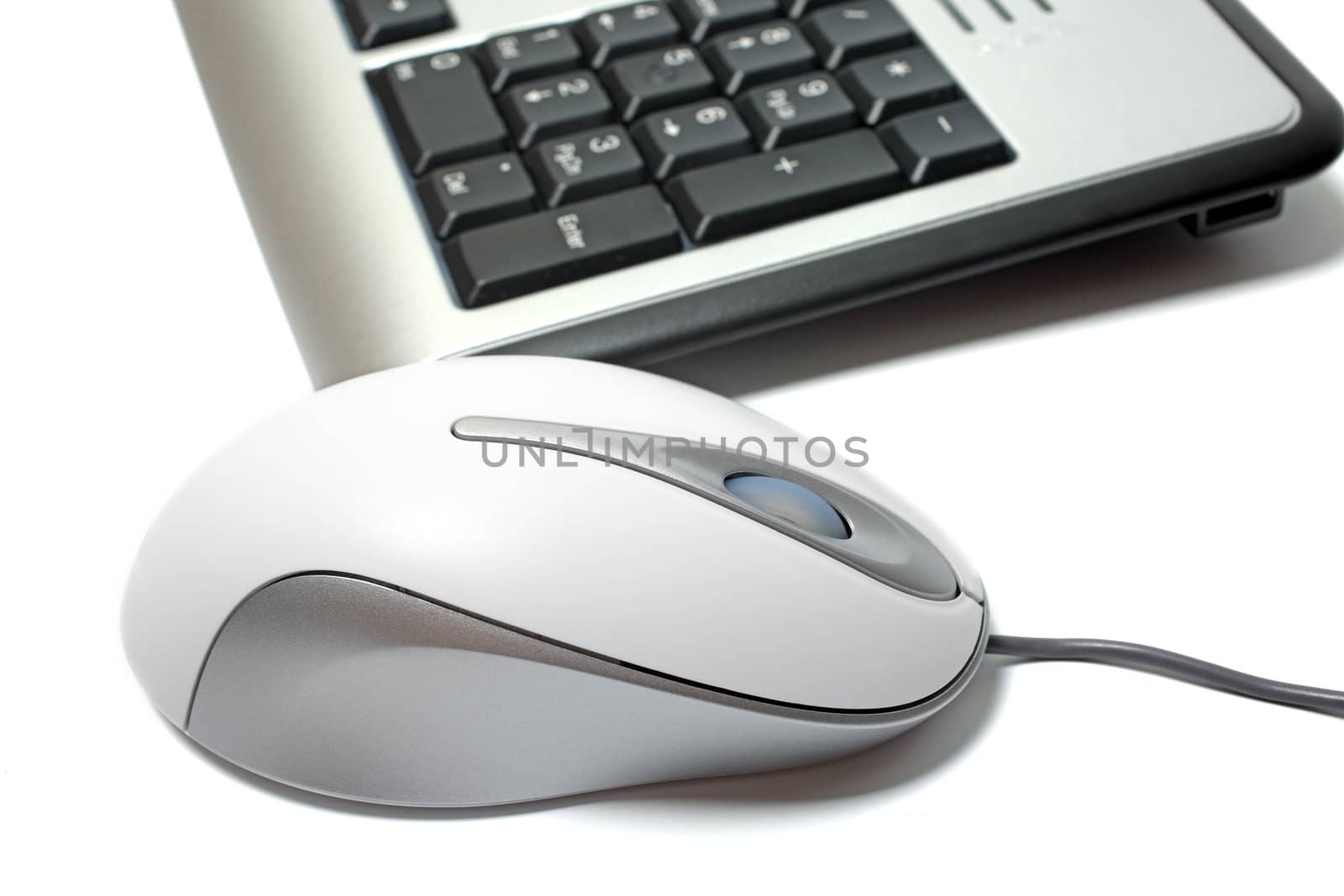 Close up of mouse and keyboard isolated on white background.