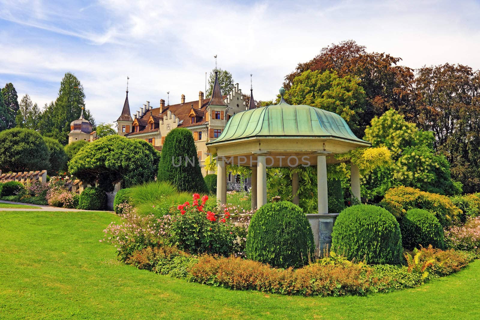 Arbor and flowers near old castle, Switzerland.