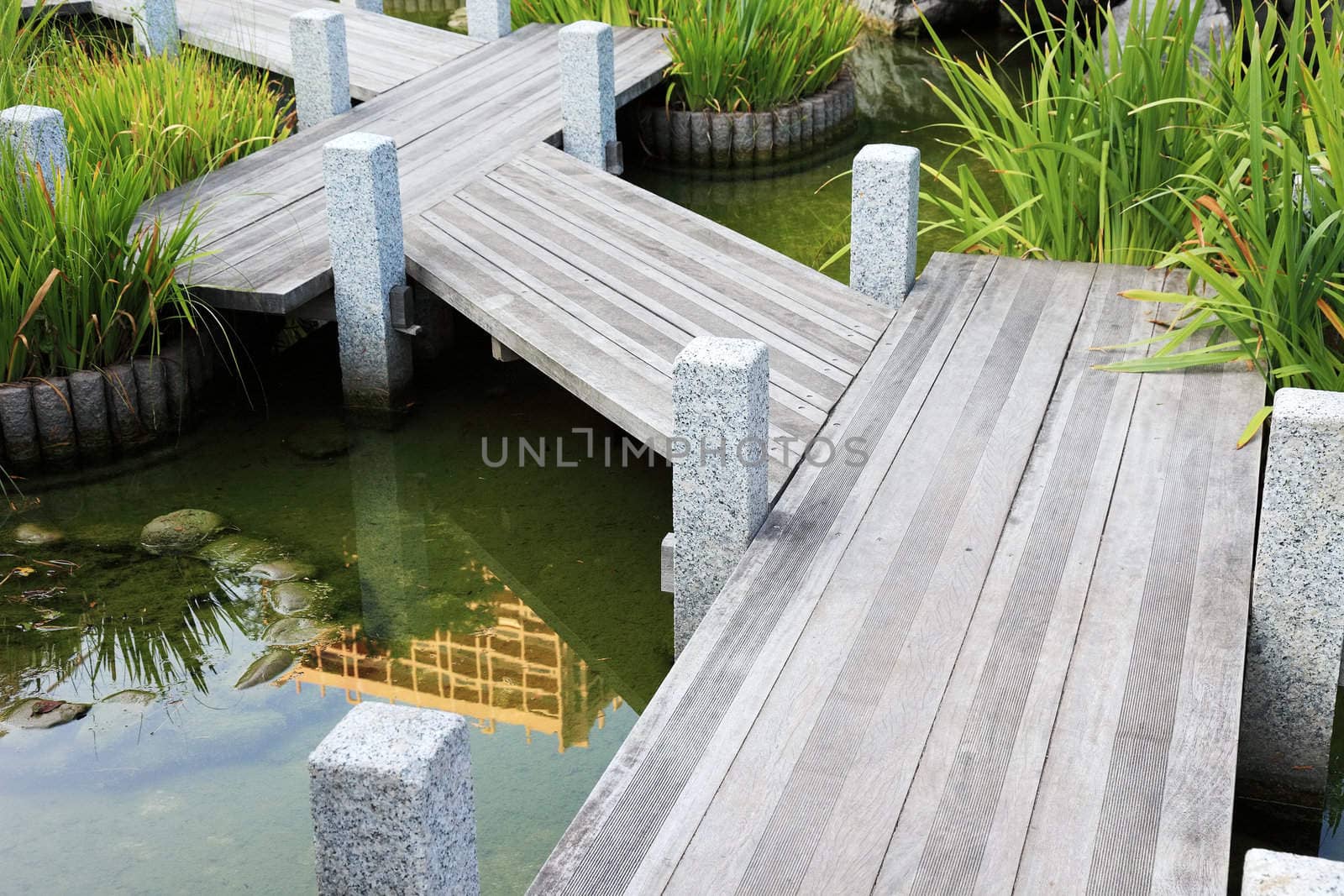 Wooden walkway in japanese garden in Monaco, Europe.