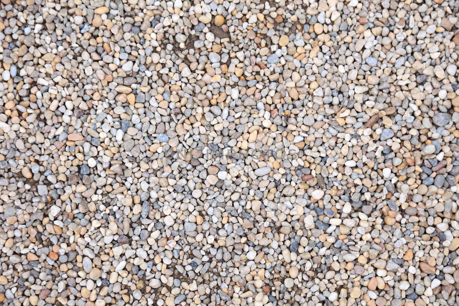 Lot of pebble stone as textured background. by borodaev