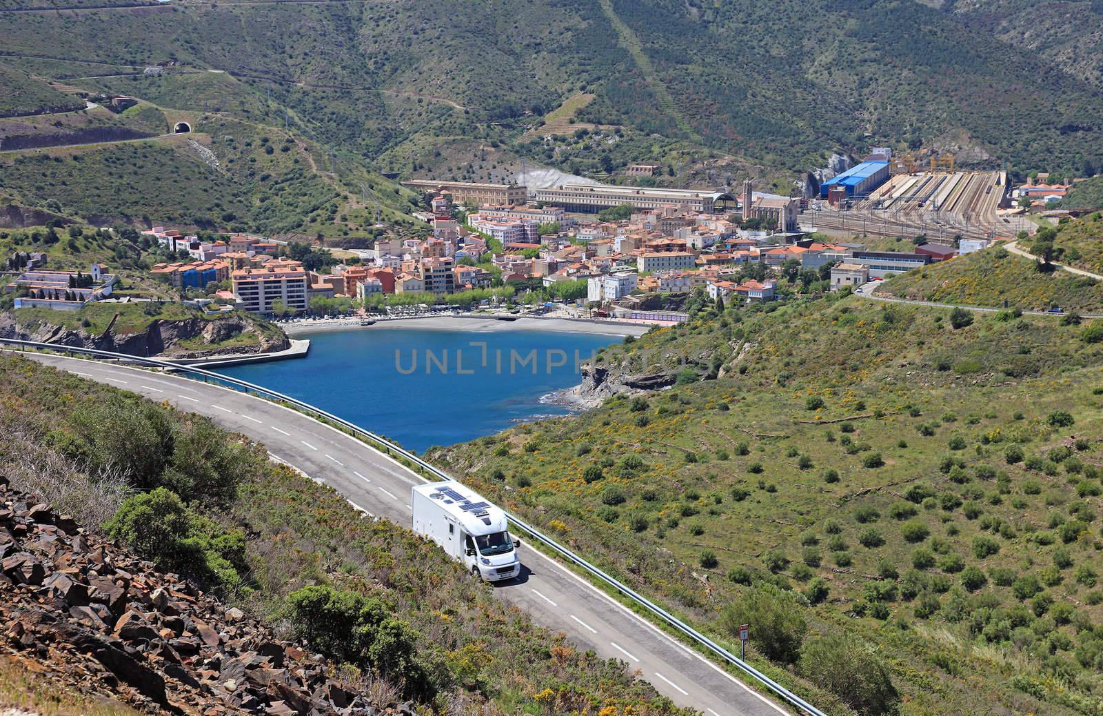 Camper on the road near spanish city Portbou, not far from border between Spain and France.