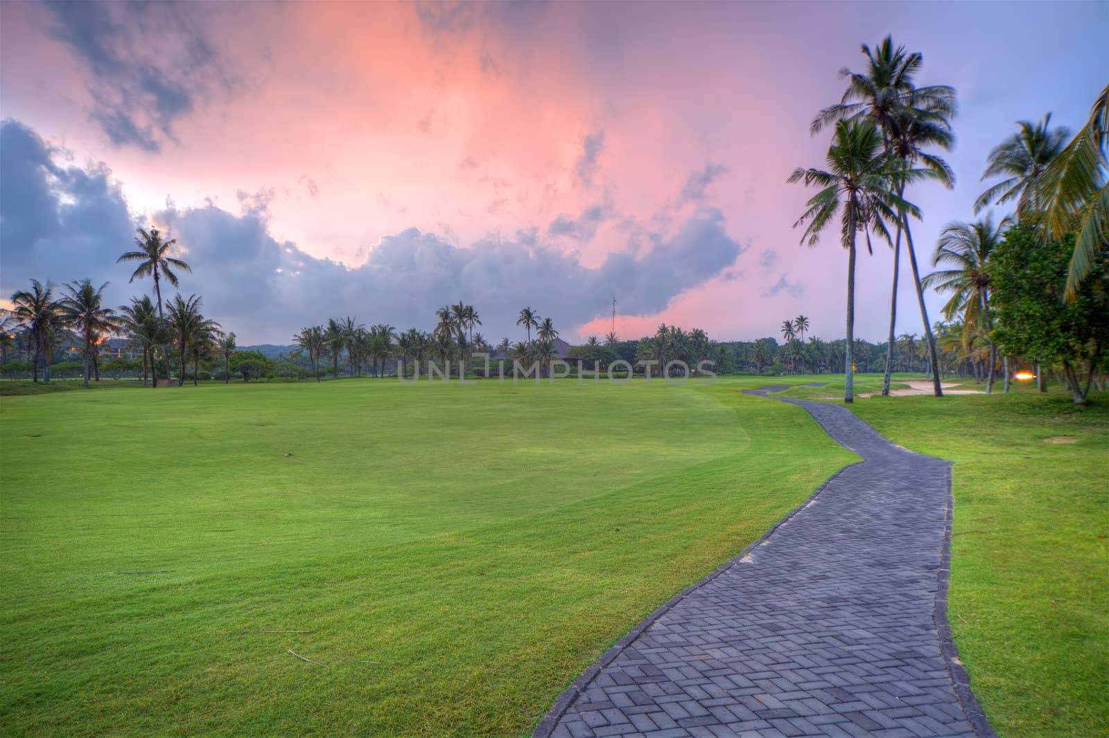Golf field during sunset time, Bali, Indonesia. HDR photography.