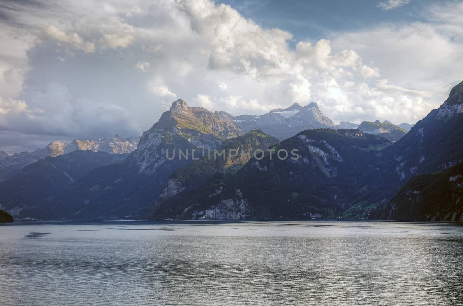 Picturesque swiss lake and alps before sunset, Switzerland, Euro by borodaev