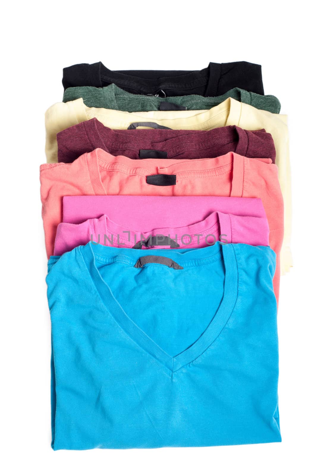 Group of multicolored t-shirts isolated on white