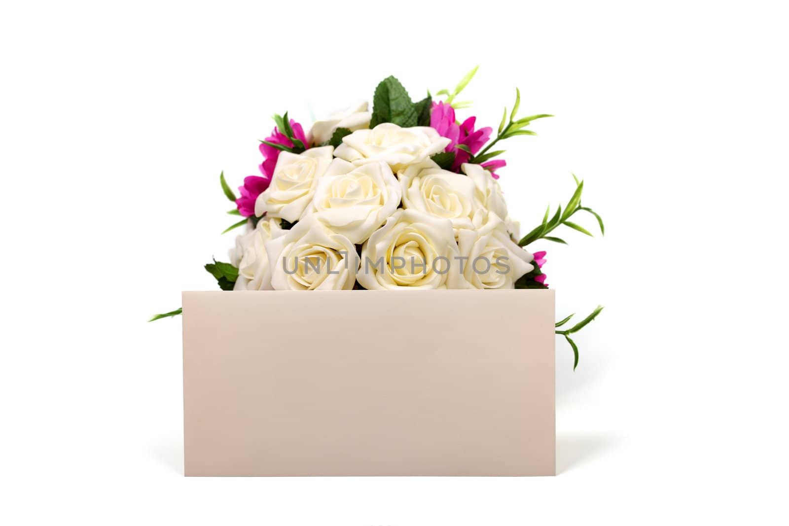 Bunch of roses and textured blank envelope isolated on white bac by borodaev