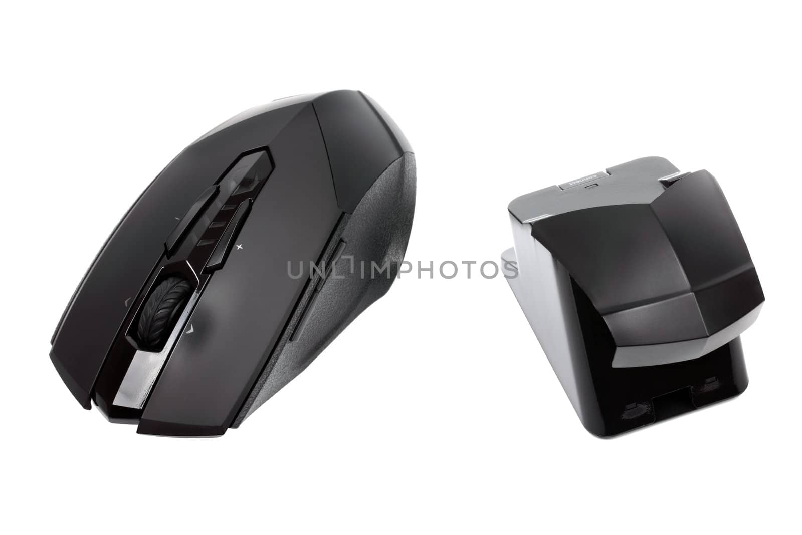 Modern wireless mouse and reciever isolated on white background.
