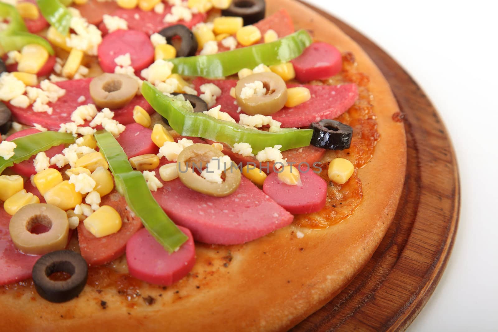 Pizza with vegetables served on wood dish