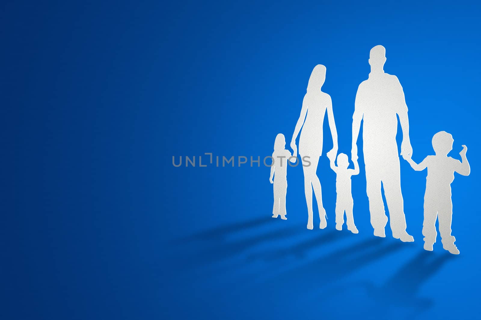 A family cutout from paper standing and casting shadows.