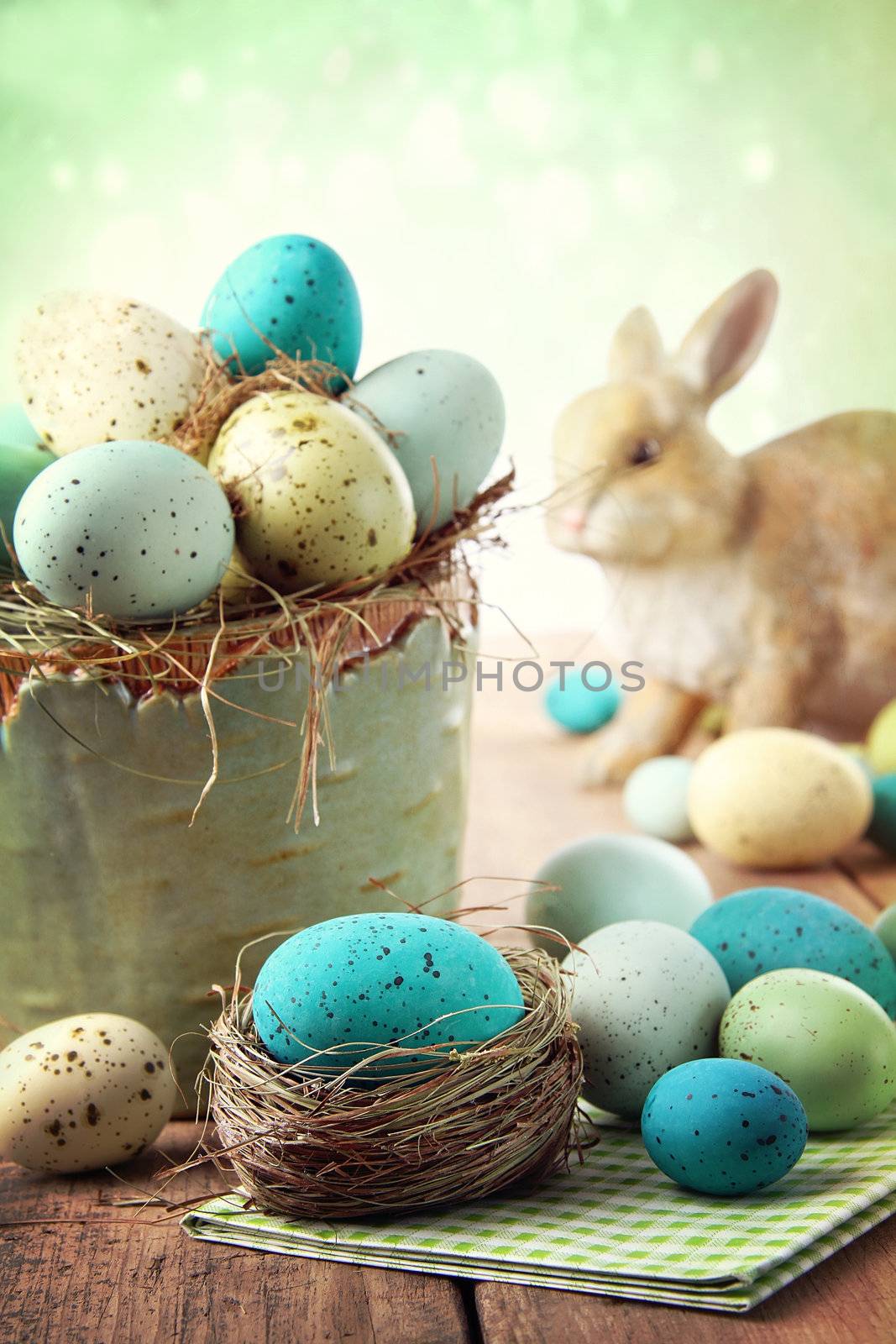 Easter scene with turquoise speckled egg in bowl