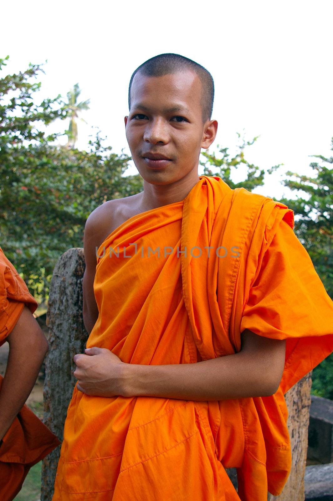 Cambodian Buddhist man wearing orange robes.