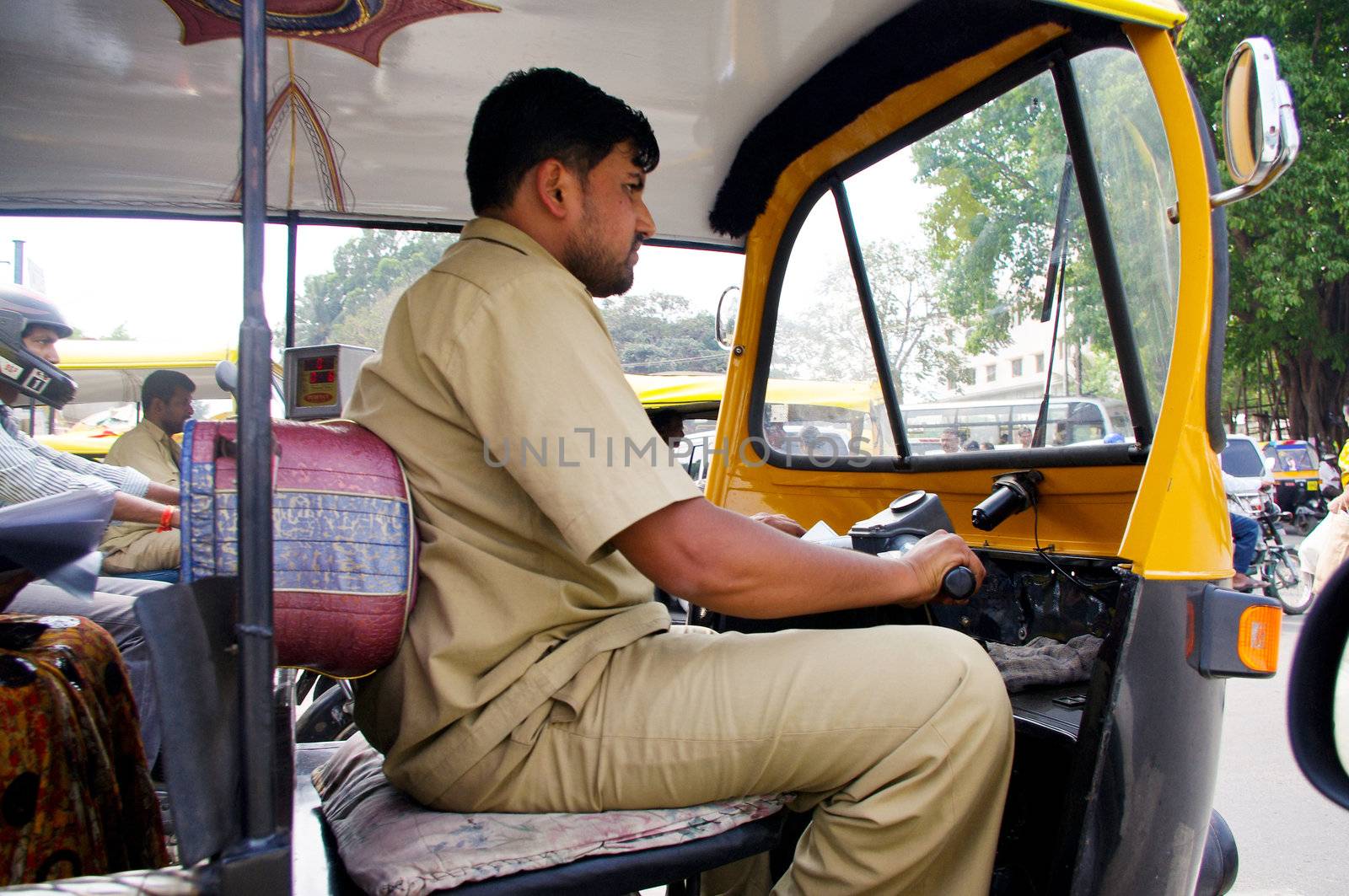 Autorickshaw driver in his taxi, Bangalore (Bengalaru), karnataka, India.