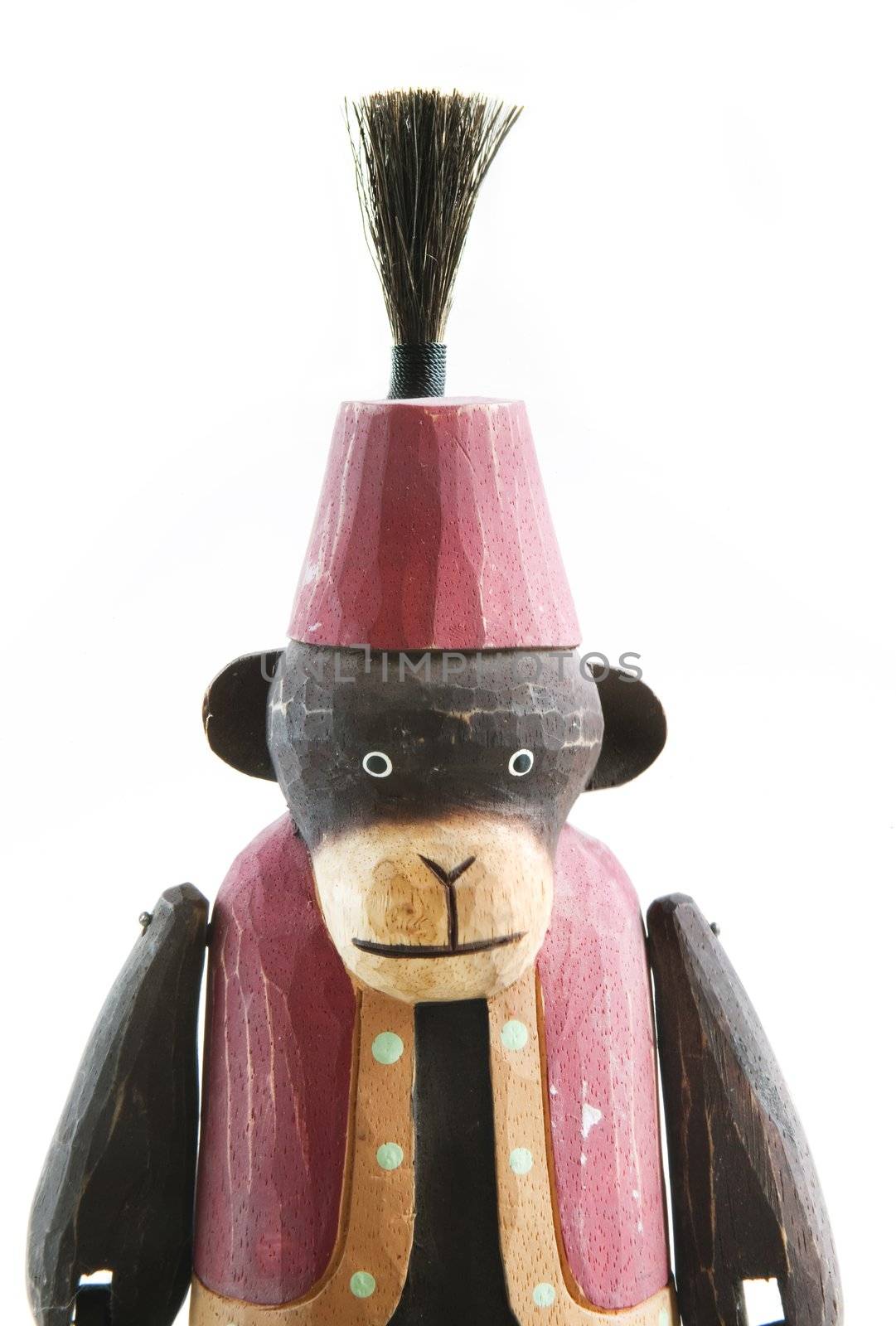 Wooden monkey in a vest and fez medium shot isolated on pure white.